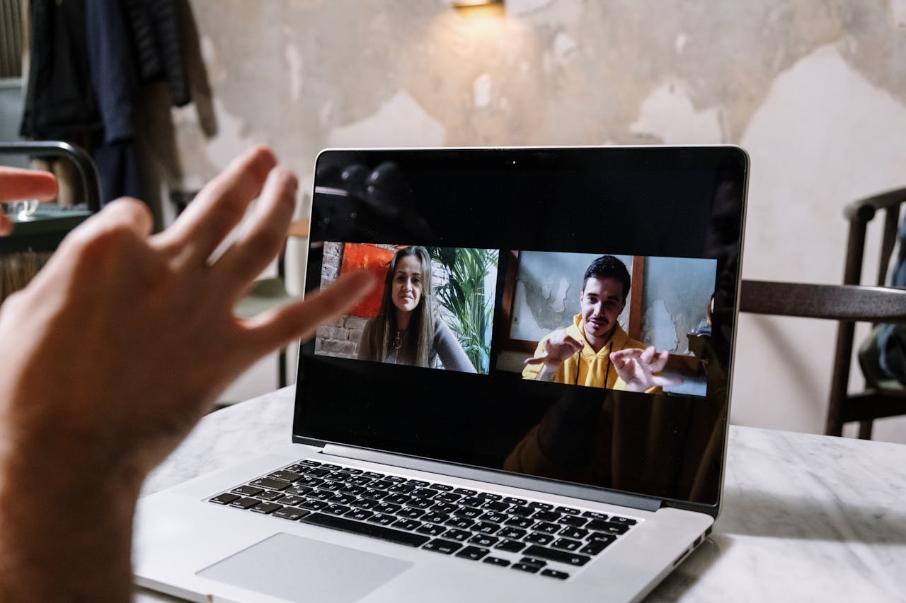 Student learning English online via video call with a friendly tutor